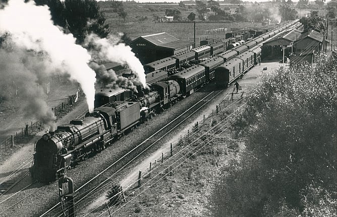 Full house – three trains crossing at Otaki. Taken from the top of the water vat in the Otaki yard. January 5, 1935
