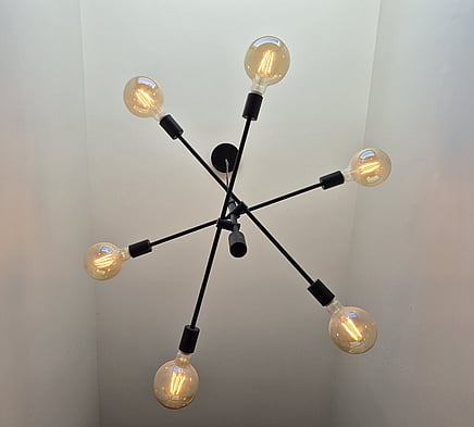 Image of a fancy light fitting as a statement piece in a hallway