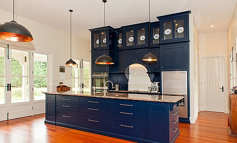Timber accents in the kitchen, adding warmth and sophistication by Barrett Joinery.