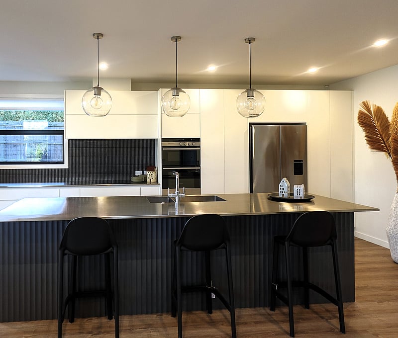 Luxury kitchen with marble benchtops and high-end fittings, showcasing Barrett Joinery&rsquo;s expertise in kitchen design.