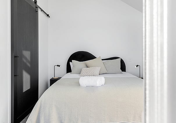 King sized bed in master lakefront unit at Roam Taupo