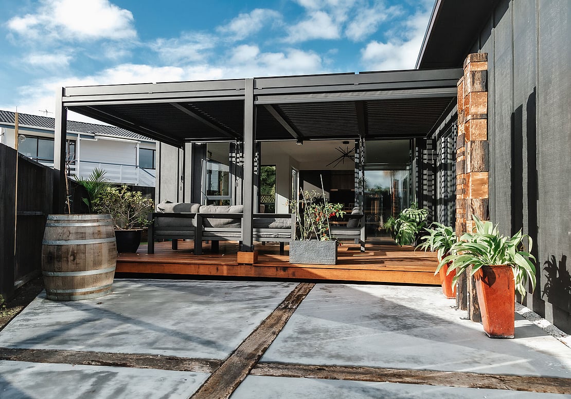 New deck built with black louvered pergola.  