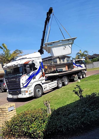 Photo of Pukekohe Hiab Transport hiab crane truck lifting a fibreglass pool