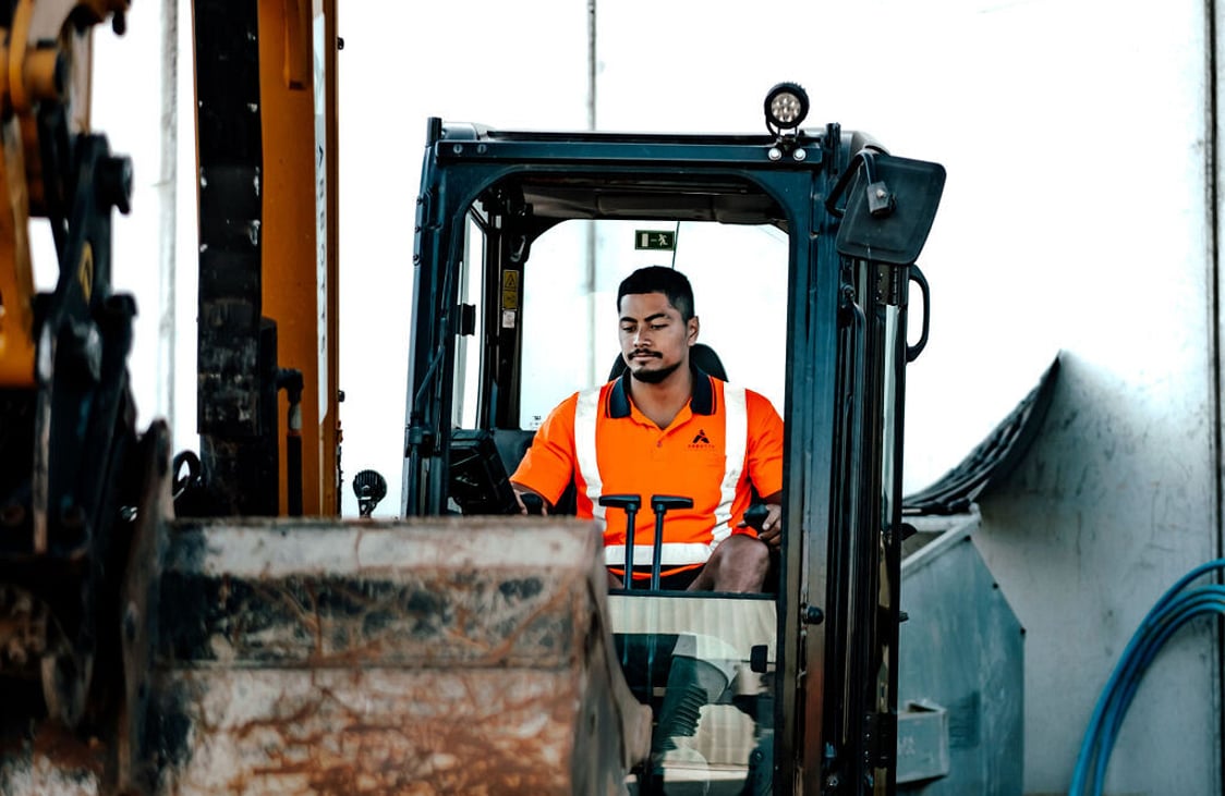 Abbotts operator driving an excavator on a civil works job