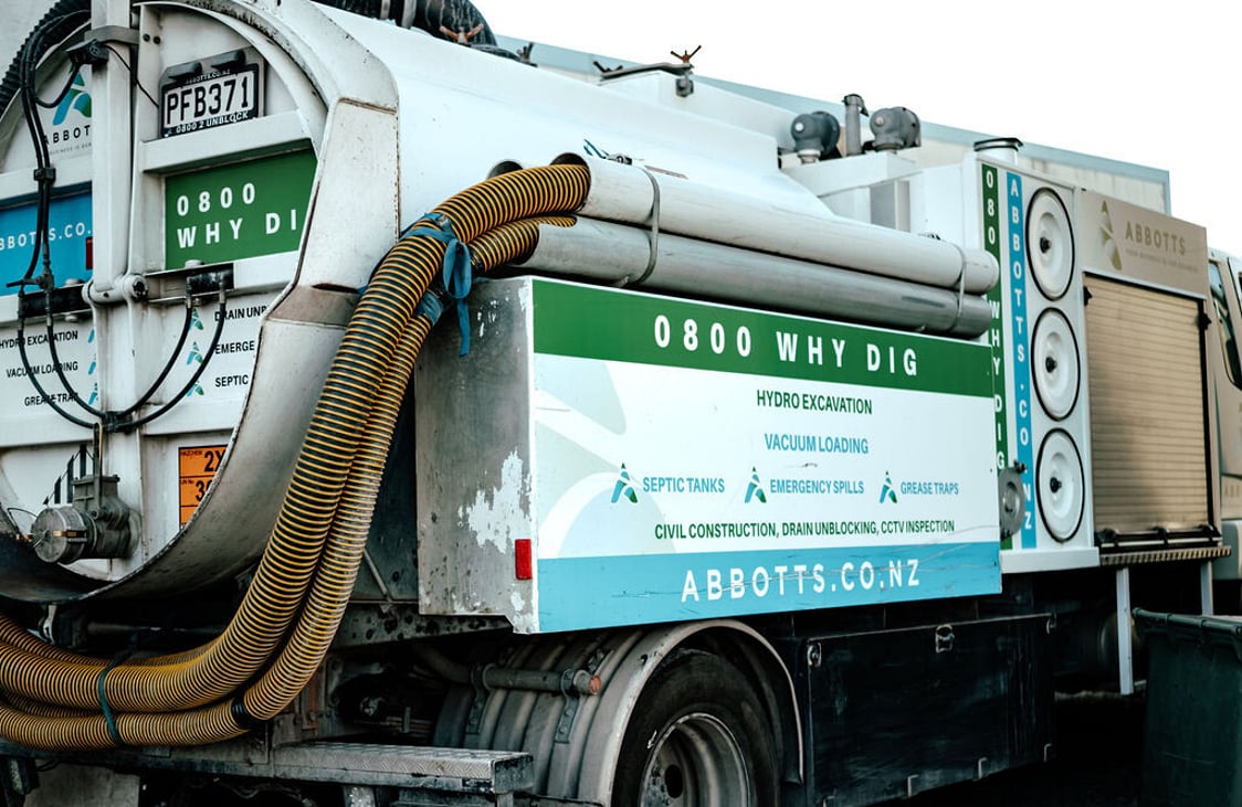 Abbotts vacuum truck with suction hoses for cesspit and septic tank cleaning
