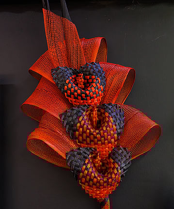 A red bouquet hand-made with woven flax. Also known as a Harakeke