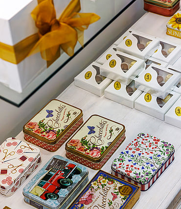 Traditional tins of chocolates with different printed designs