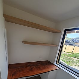 Office nook with shelving and custom timber desktop..