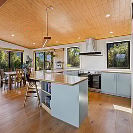 Kitchen with heirloom timber totara benchtop.