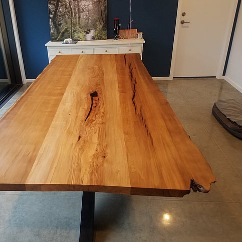Beautiful wooden table with steel legs made by Harwood Joinery.