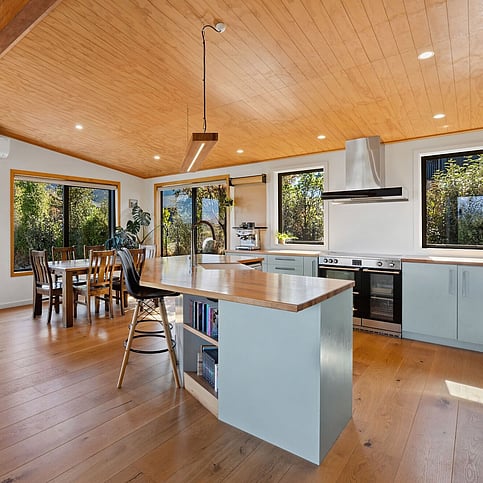 Kitchen with totara heirloom timber benchtops made by Harwood Joinery.