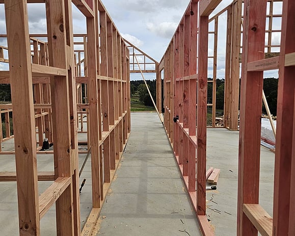 Framing stage at house build showing view from master suite