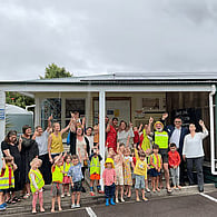 Group of children and teachers gathered outside an early childhood education centre