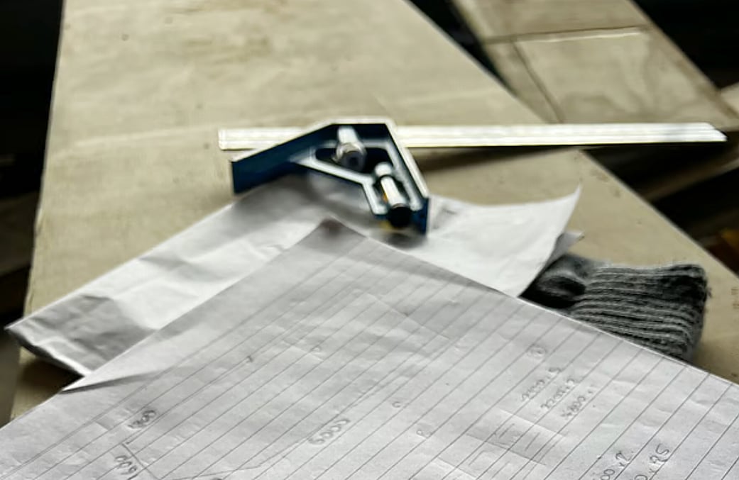 Image of plans drawn on a clipboard
