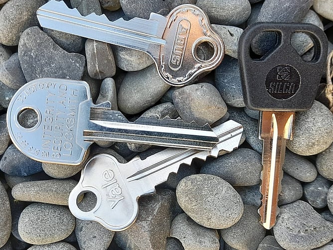 Multi key image on pebble background