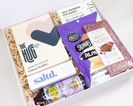 NZ DESIGNED HEAT PACK, MAGNESIUM, CHOCOLATES AND A NZ MADE JUICE