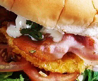 THE BOMB - Crumbed Chicken Breast, Bacon & Garlic Aoili