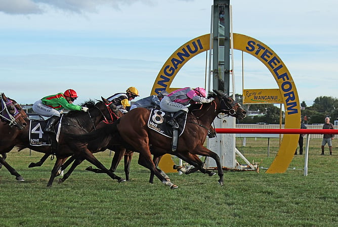 Girl Talk (pink cap) will contest the Gr.3 Windsor Park Stud Manawatu Breeders’ Stakes (2040m) at Wanganui on Easter Monday. - Photo: Peter Rubery (Race Images)