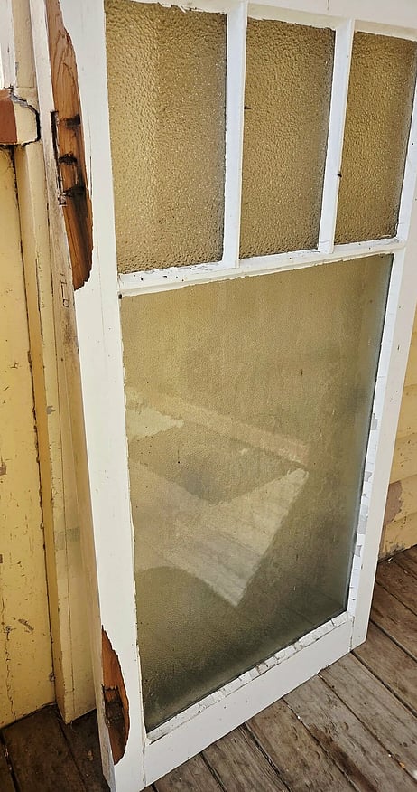 Window framing chipped paint and broken