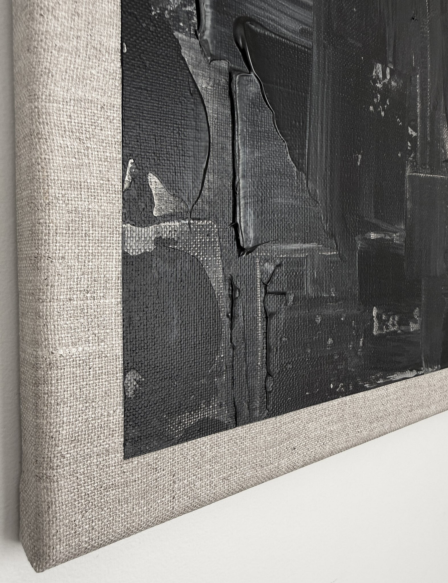 side view showing black impasto buildup toward linen edge, dragged paint marks, exposed linen weave and canvas depth
