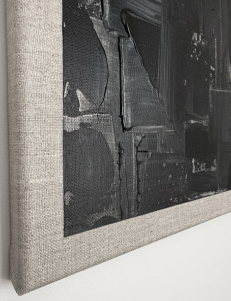 black and pale cream acrylic on linen, impasto edge over raw linen margin, vertical drag marks, matte field, visible weave