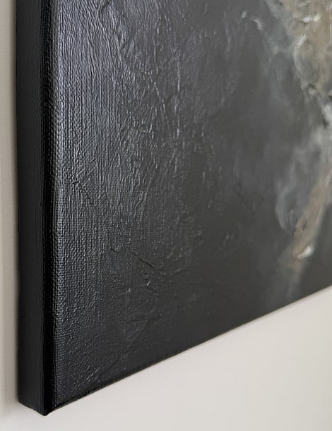 black and brown textured acrylic and ink on linen, painted surface wrapping canvas edge, central impasto in brown and cream partially visible