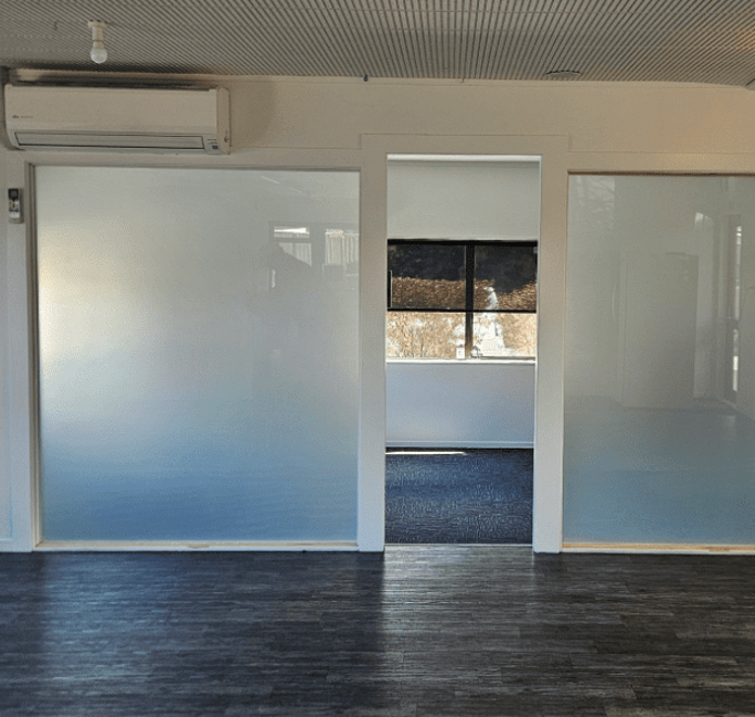 internal glass frosted sliding doors for a babies play room at a centre