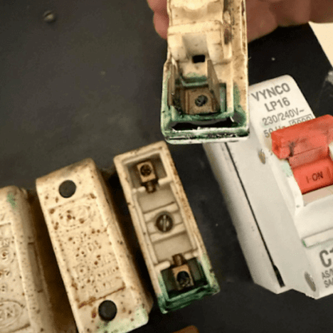 Green residue from deteriorating electrical wiring in a power point