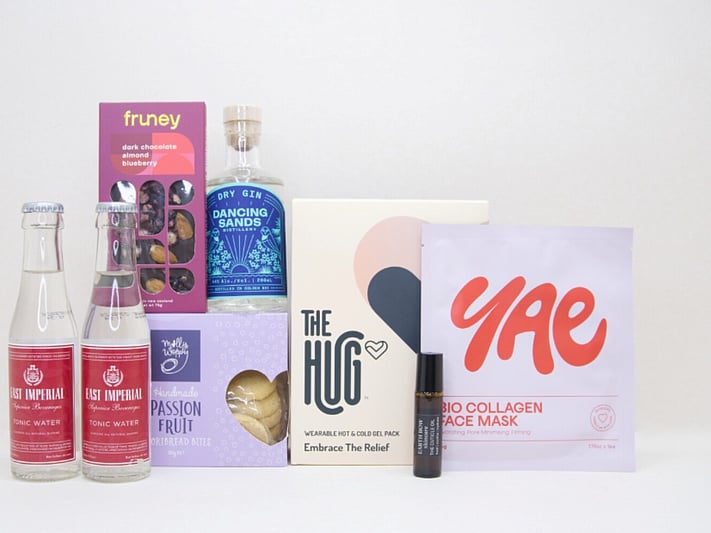 Evening Reset gift box NZ — NZ-made relaxation gift box with Dancing Sands gin, The Hug gel pack, Fruney chocolate and YAE face mask