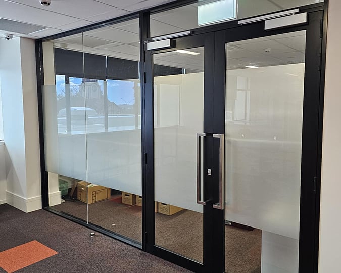 Window film on an internal partition and glass doors in a office for privacy