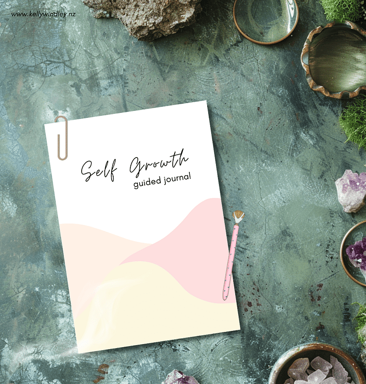 A Print Out of the Self-Growth Journal on a moss and gem background