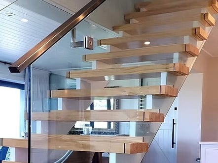 Internal staircase floating look balustrade - 12mm toughened glass with polished top cap handrail