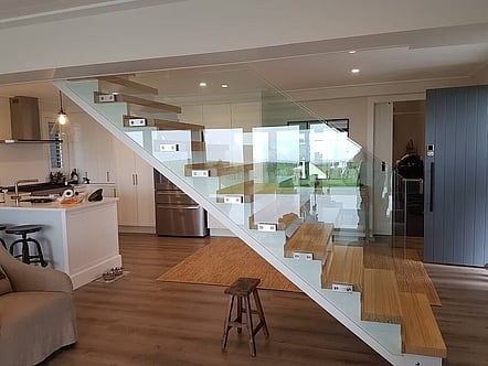 Internal staircase floating look balustrade - 12mm toughened glass with polished top cap handrail