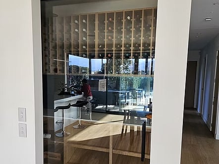 Sliding glass door with black hardware for wine cellar