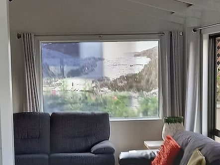 Transparent printed layer of double glazed unit to create a unique art piece and privacy at this Lake home
