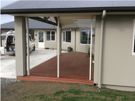 Sleek glass wall acting as a windbreak without closing in this lovely deck area