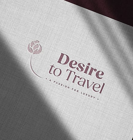 Desire to travel logo on testured paper showing a rebrand by Poppyseed Design