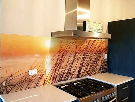 Grass and beach sunset splashback