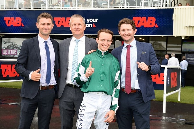 Benji (left) and Harry King flank Well Written’s trainer Stephen Marsh and jockey Matt Cartwright following her Gr.2 Auckland Guineas (1400m) win. - Photo: Kenton Wright (Race Images)