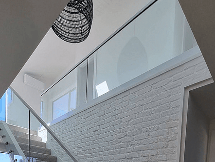 50mm stairless double disc standoffs. 12mm toughened glass and stainless top cap handrail