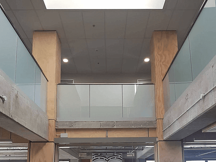 Internal anzio balustrade system with frosted glass and top cap handrail