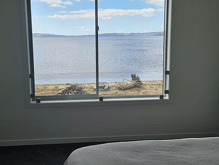 Sliding window fall protection balustrade using 13.52 sentry glass and clamps