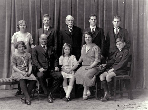 Formal portrait of adults and children.