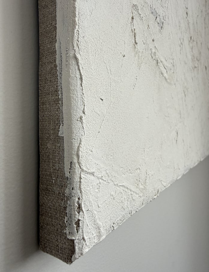 side view showing raised surface, linen edge and canvas depth