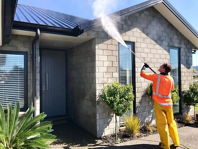 roof edge being softwashed by Dry Gutts Hamilton
