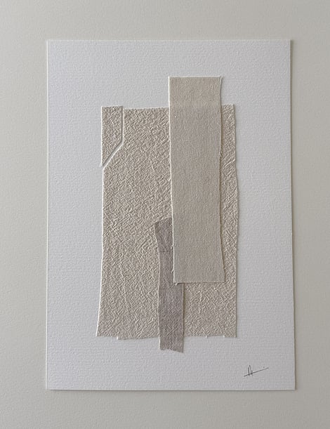 full image of layered collage with pale, beige-toned linen and cotton fragments on ivory fabriano, showing soft frayed edges and handwritten signature in lower right corner 