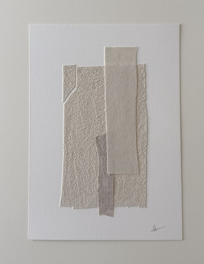 full image of layered collage with pale, beige-toned linen and cotton fragments on soft white fabriano, showing soft frayed edges and handwritten signature in lower right corner 