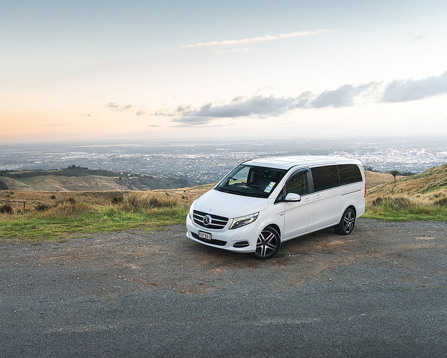 Mercedes V220d parked on hilltop at sunset