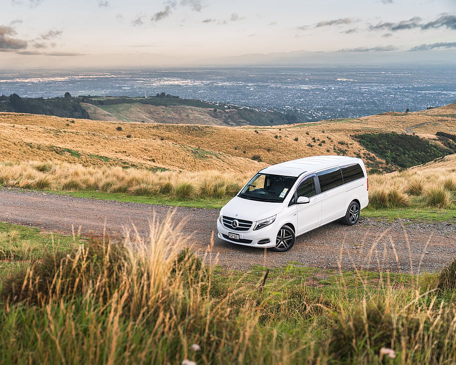 Mercedes V220d side view with hills and grassland backdrop