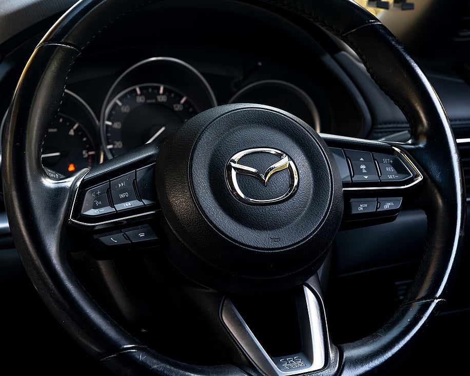 Close up of Mazda CX8 steering wheel controls